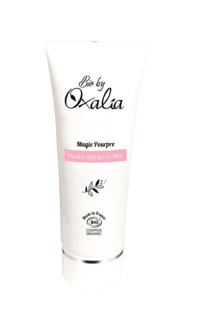 Valerie Millet Un tubo blanco de mascarilla facial Bio by Oxalia "Magie Pourpre Masque Effet Bonne Mine". El tubo incluye logotipos que indican que está fabricado en Francia y tiene la certificación COSMOS ORGANIC. Bienestar Holistico